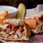Kickin' Chicken: a tasty sandwich, fries and pickle
