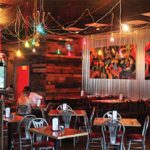Triangle Char &amp; Bar: The design of the Mount Pleasant location is nouveau garage with graffiti, corrugated metal walls and garage doors.