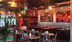 Triangle Char & Bar: The design of the Mount Pleasant location is nouveau garage with graffiti, corrugated metal walls and garage doors.